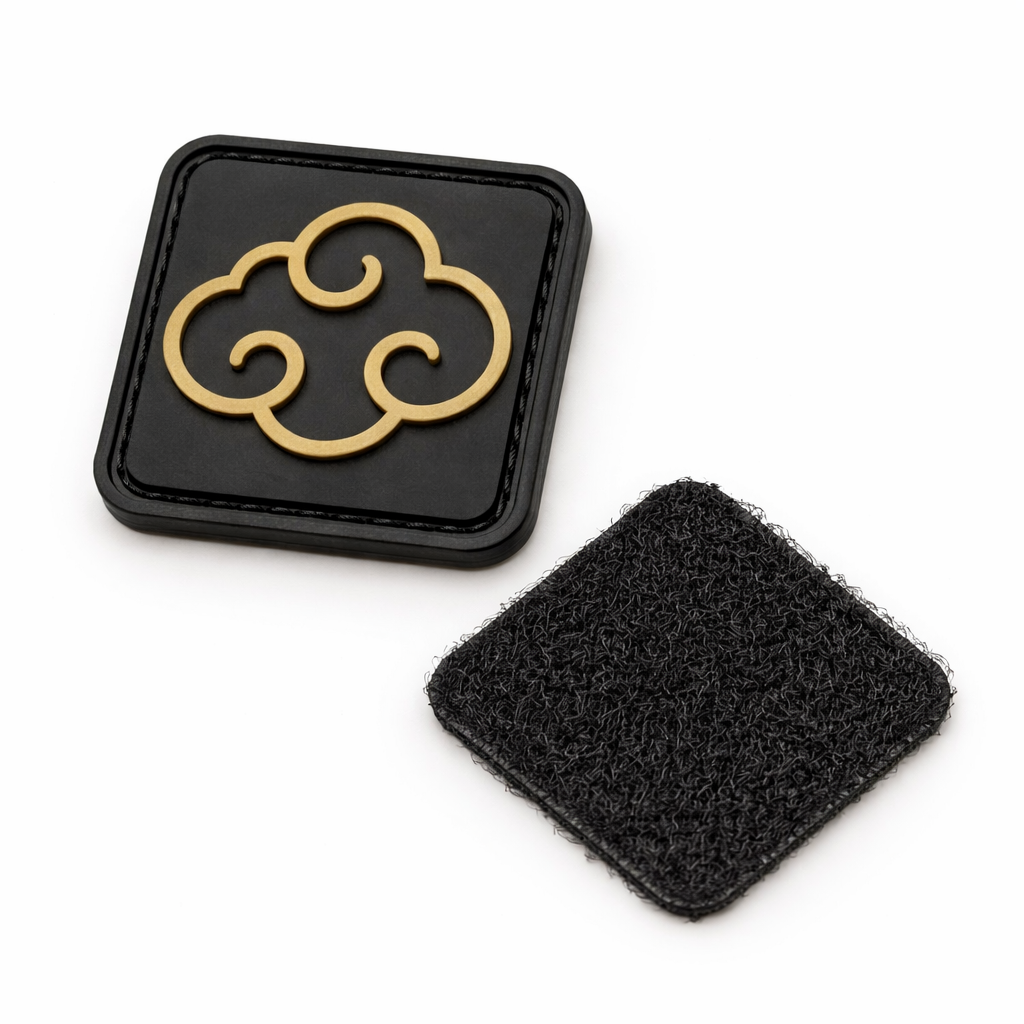 FirmGuards gold cloud PVC morale patch with hook and loop backing on white background